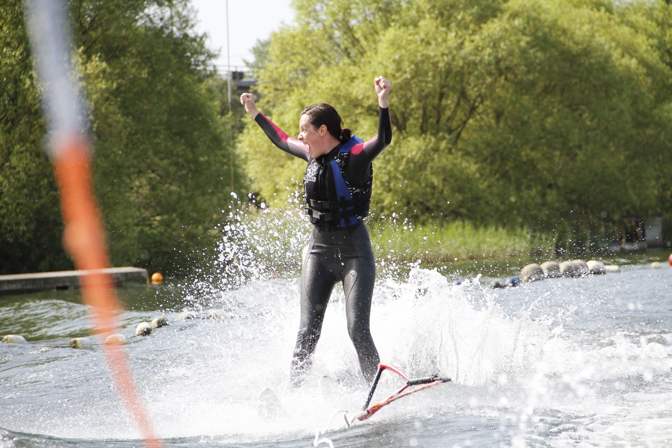 Hannah standing on a water ski